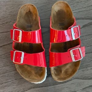 Red patent leather Birkenstock’s.